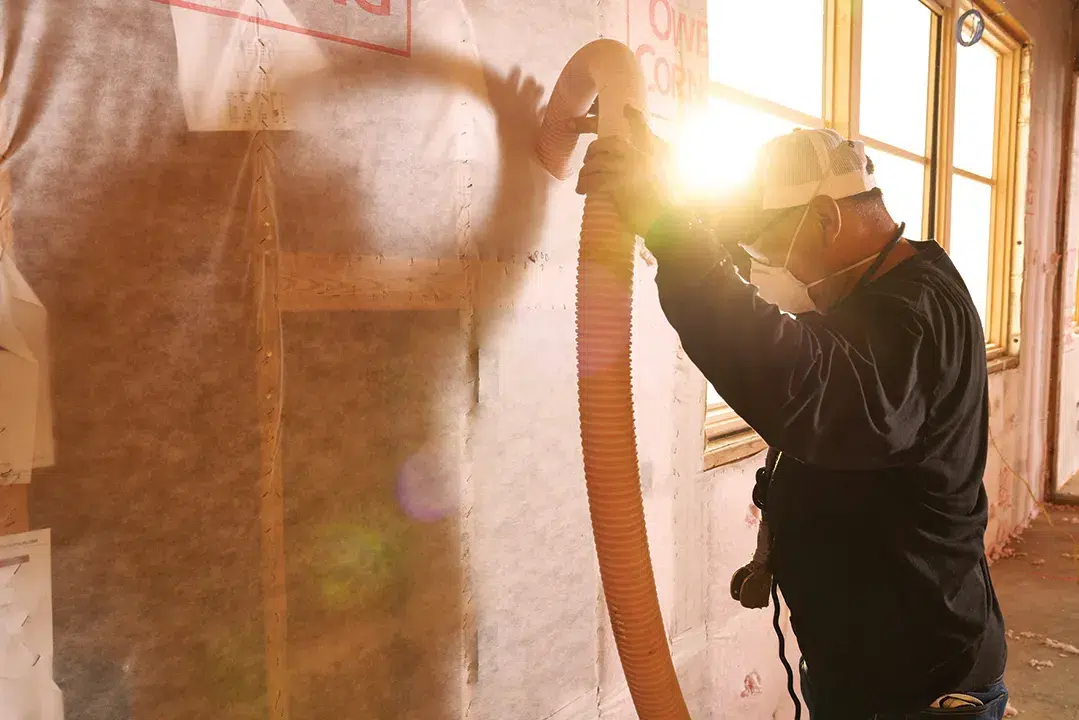 A Marshall's insulation expert installs new insulation in an Oregon home's attic.