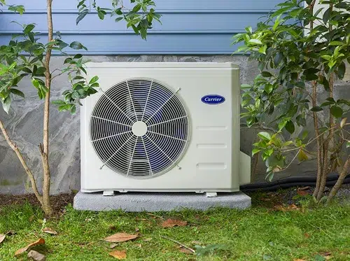An image of a Carrier HVAC system outside of a home.