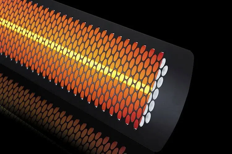 A closeup image of a patio heater, turned on.